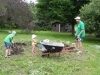 Kids helping dad with dirt pile